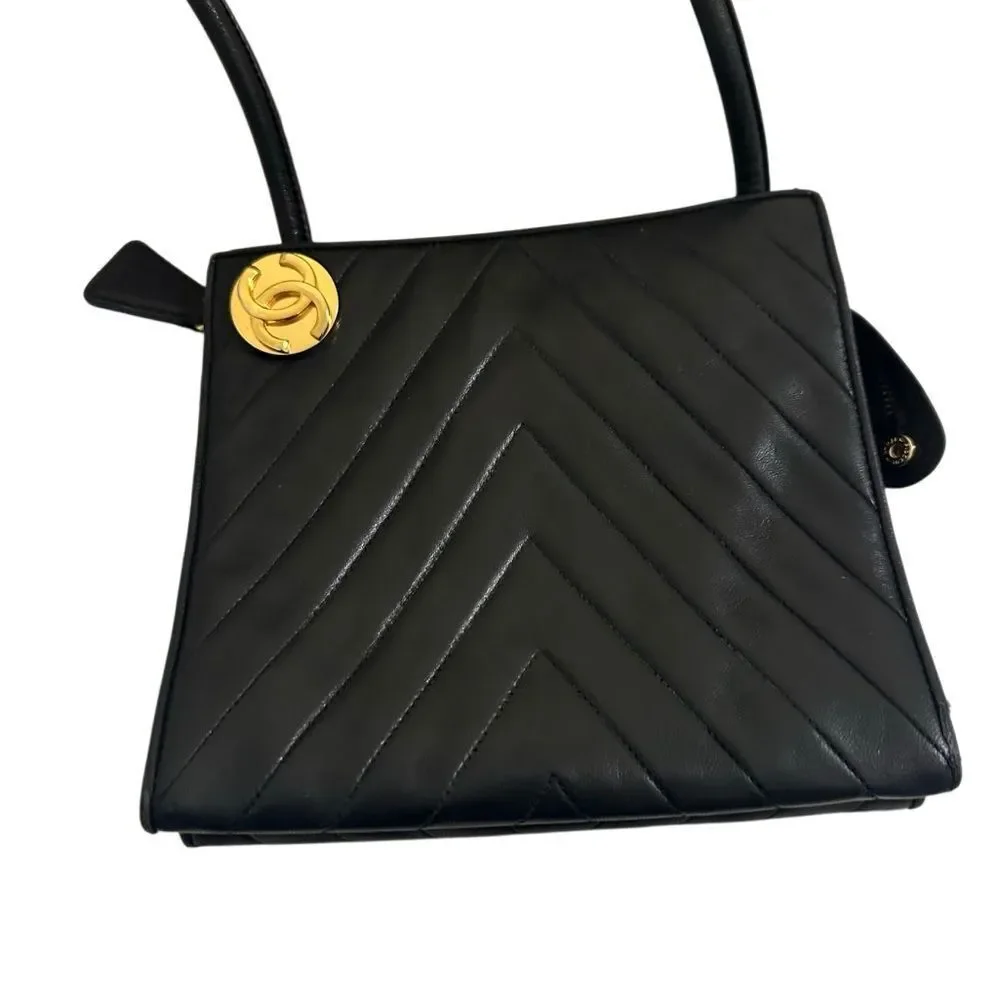 CHANEL Black Chevron Leather Shoulder Bag with Gold Accent